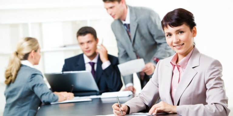 Work colleagues sitting at a meeting table