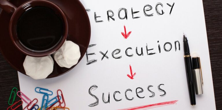 Image of written words on a page - Strategy, Execution and success
