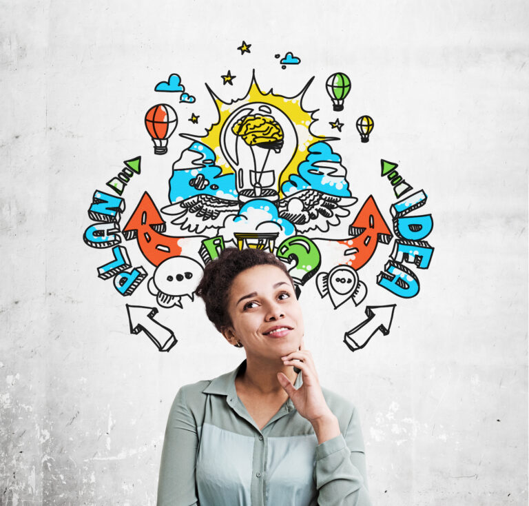 Portrait of an African American woman standing near a concrete wall with a colorful plan and idea sketch drawing on it.