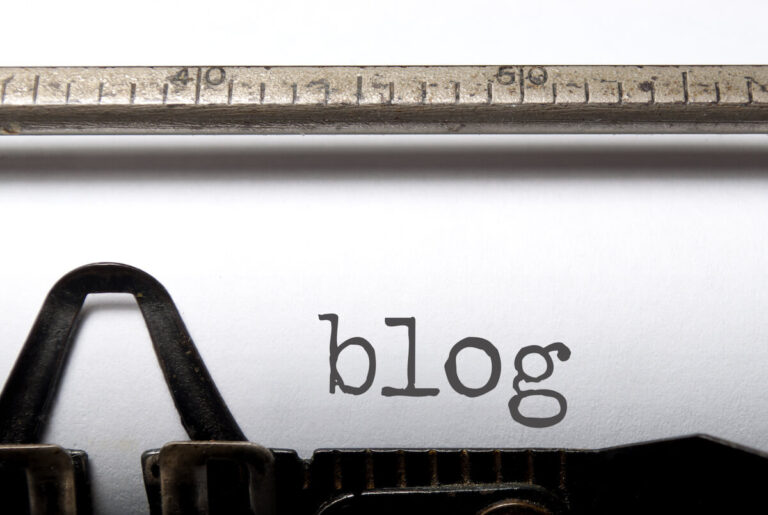 type writer with blog written on the page