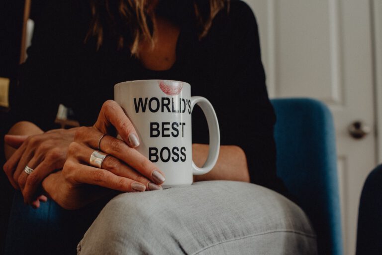 Trust Matters – Why is it so important in the workplace? woman wityh mug saying worlds best boss