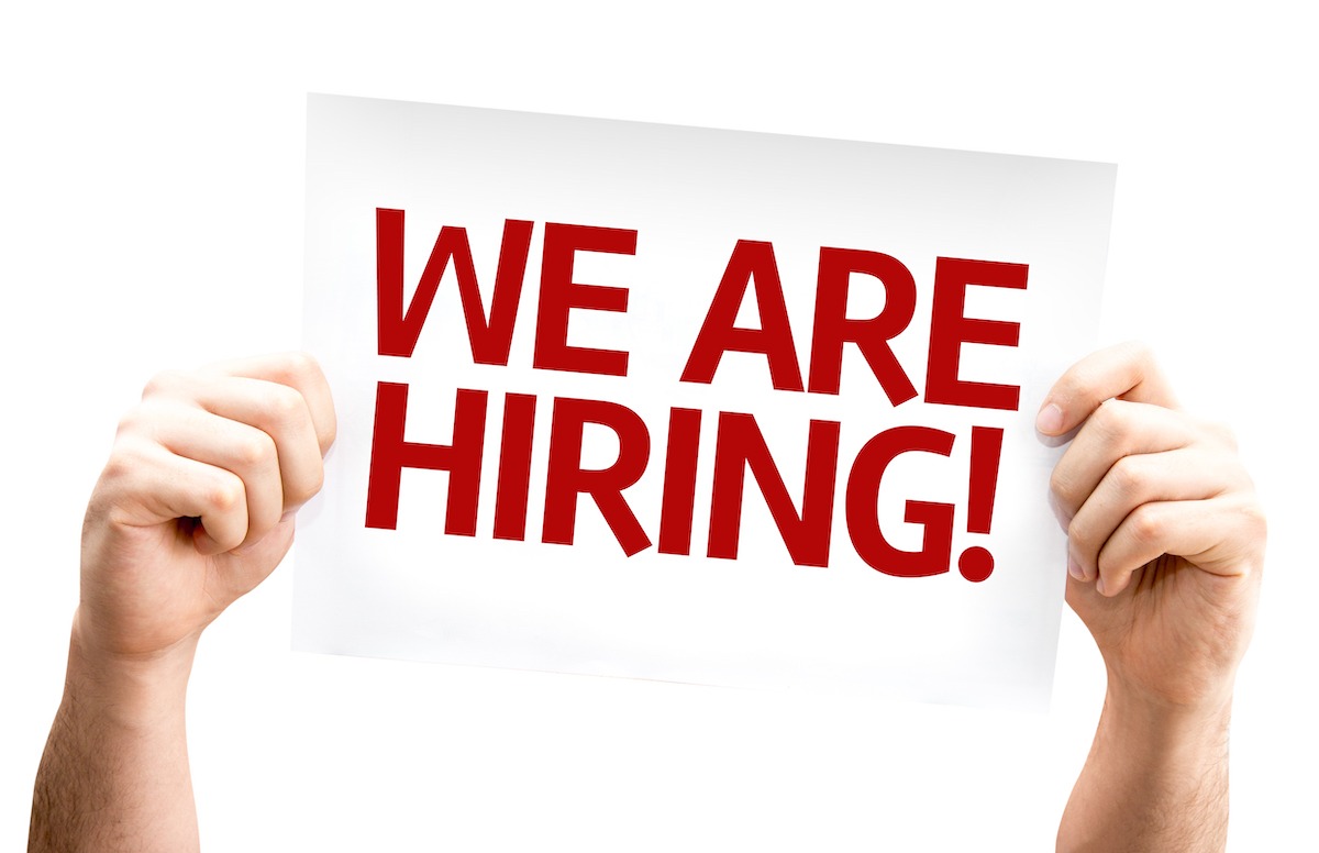 we are hiring sign held up