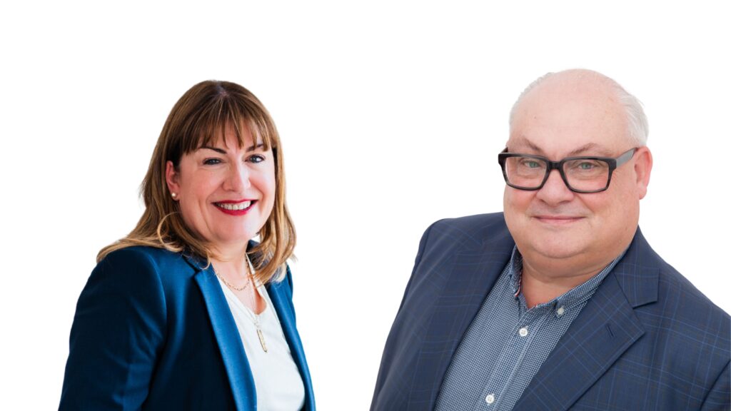 Antoinette Oglethorpe and Mark McKergow wearing business attire and smiling; Antoinette has shoulder-length brown hair and a blue blazer, while the Mark has glasses, short grey hair, and a checked jacket. Both are pictured against a white background. in t6he promotional bannewr for the webinar Solutions Focus and Mentoring