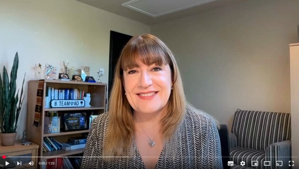 Antoinette Oglethorpe smiling to camera on a personalised teaser video prepared for a client event, you can watch the teaser on YouTube and Vimeo