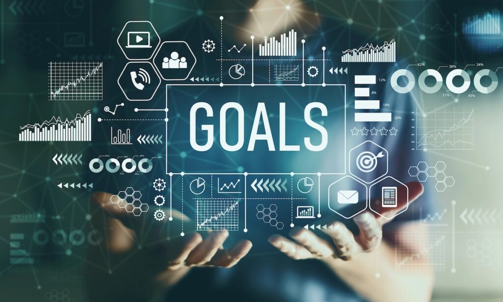 A person holds their hands open beneath the word 