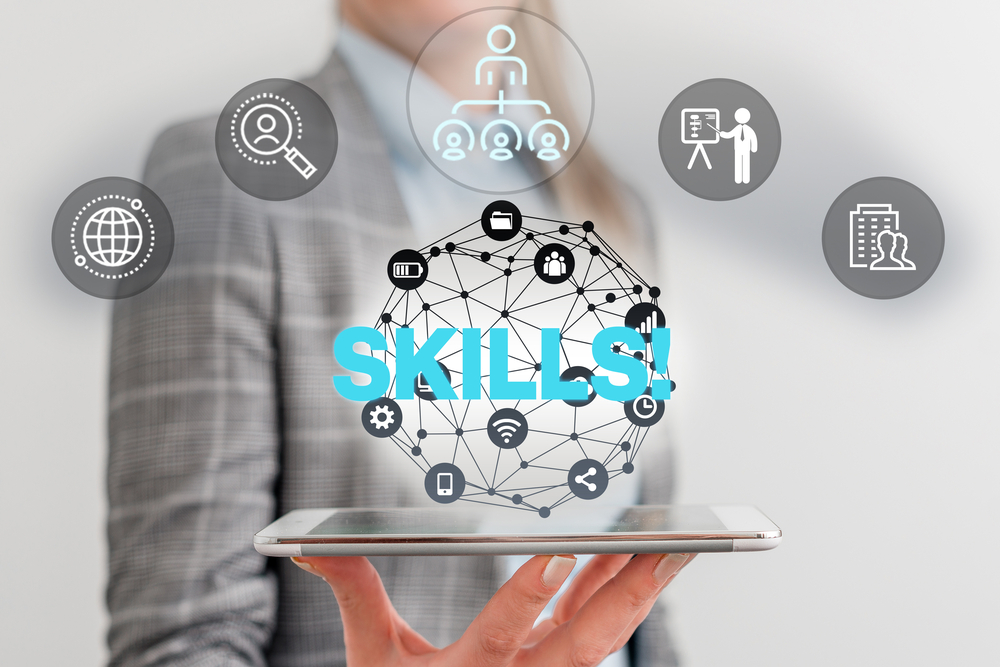 A person in business attire holds a tablet with the word